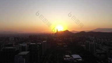 Santiago City Skyline at Sunset. Aerial View. Las Condes Commune. Chile. Drone Flies Sideways